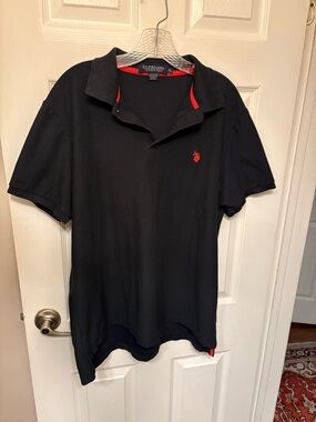 U.S. Polo Assn. Black Polo with Red Logo Accent